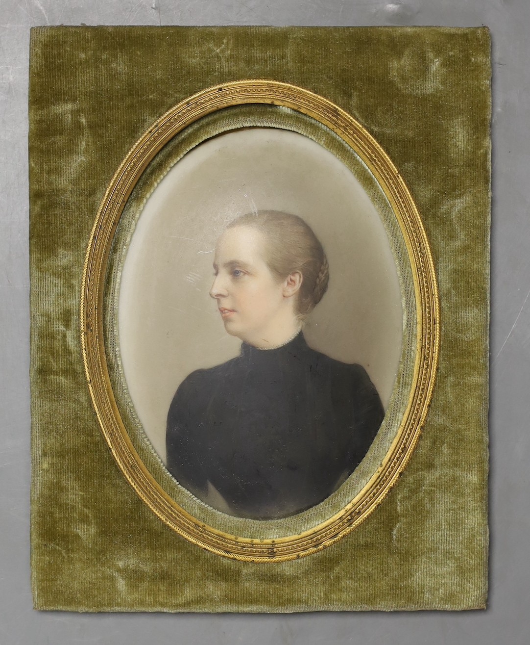 A late 19th century painted porcelain portrait plaque, in felt mount. 18x14cm total